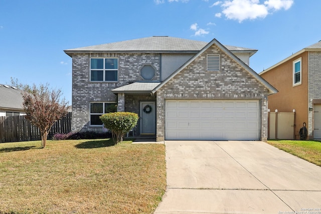 view of front property with a garage and a front lawn