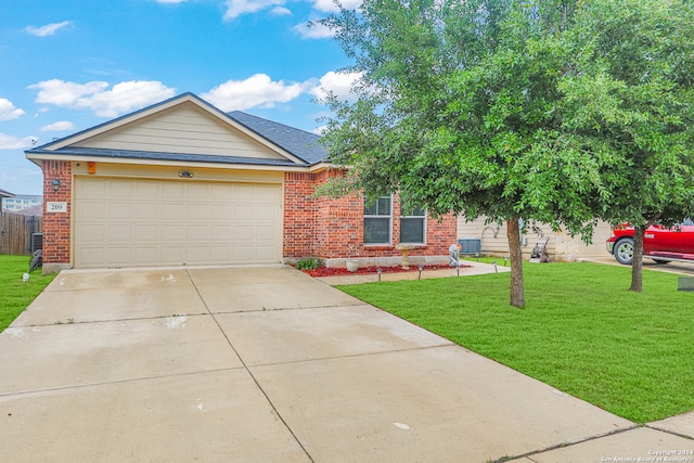 view of front of home with a front lawn and a garage