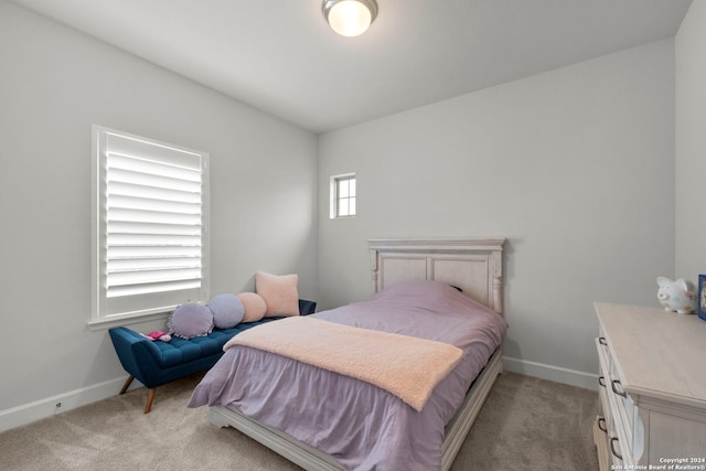 bedroom with light colored carpet