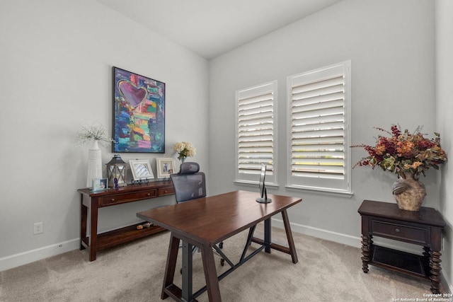 office area featuring light carpet