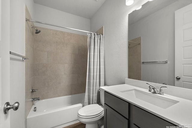 full bathroom with vanity, shower / bath combination with curtain, and toilet