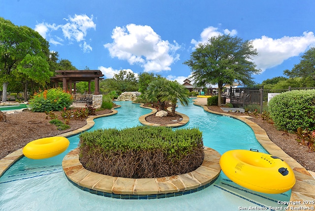 24054 Sidehill Lie, San Antonio, TX 78261 - view of swimming pool featuring fence and a pergola