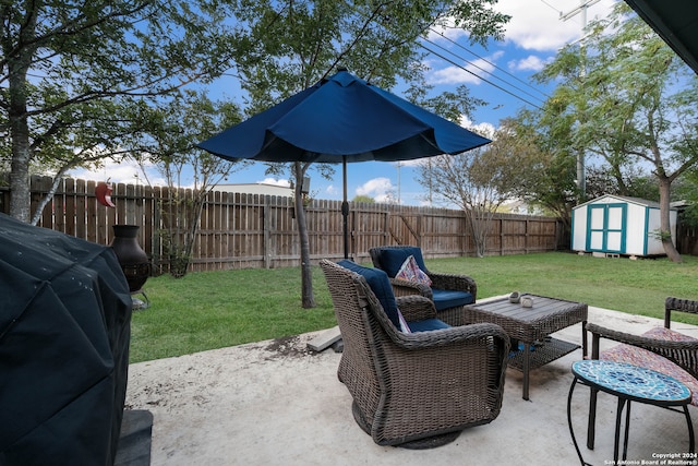 view of patio / terrace featuring a storage shed and area for grilling