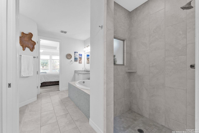 bathroom featuring vanity, separate shower and tub, and tile patterned floors