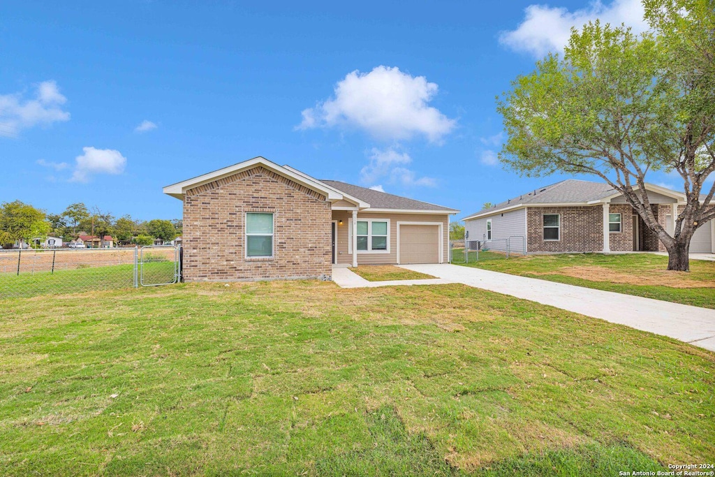 518 Precious Dr, San Antonio, TX 78237 - ranch-style home featuring a garage, brick siding, fence, a front lawn, and concrete driveway
