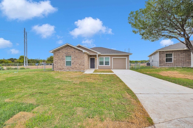 518 Precious Dr, San Antonio, TX 78237 - ranch-style house featuring driveway, a garage, brick siding, fence, and a front lawn