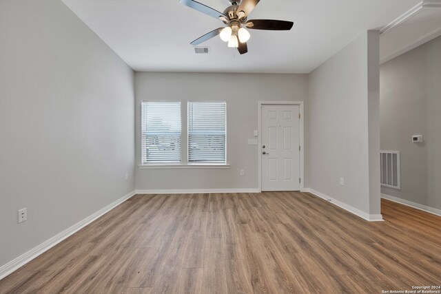 spare room with ceiling fan and hardwood / wood-style flooring