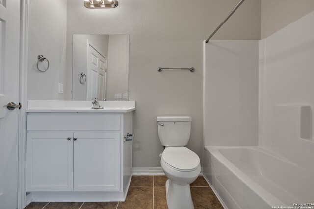 full bathroom with vanity, shower / tub combination, toilet, and tile patterned floors