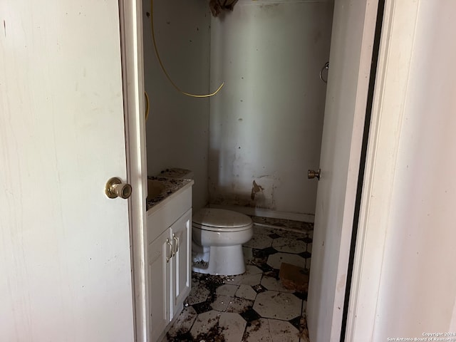 bathroom featuring toilet and vanity