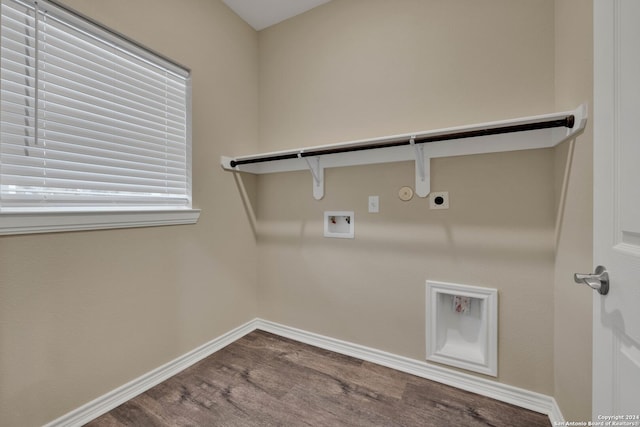 laundry room featuring baseboards, gas dryer hookup, wood finished floors, hookup for an electric dryer, and laundry area
