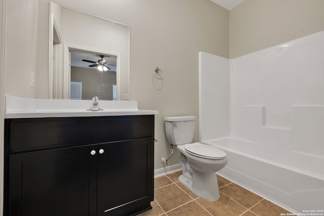 full bathroom featuring toilet, ceiling fan, vanity, tile patterned flooring, and tub / shower combination