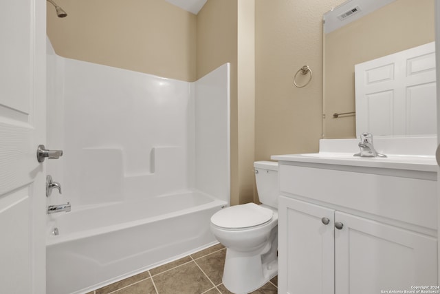 full bathroom featuring vanity, tile patterned flooring, toilet, and shower / bath combination