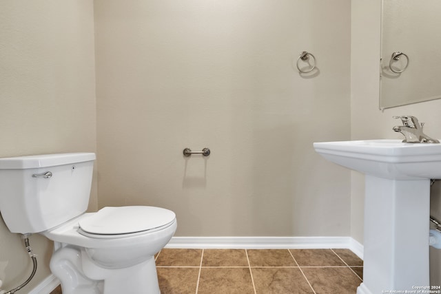 bathroom featuring toilet and tile patterned floors