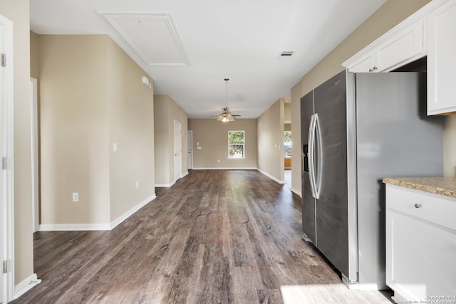 kitchen featuring light stone countertops, dark hardwood / wood-style flooring, ceiling fan, white cabinets, and stainless steel fridge with ice dispenser