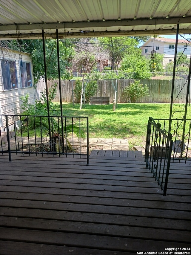 wooden terrace with a yard