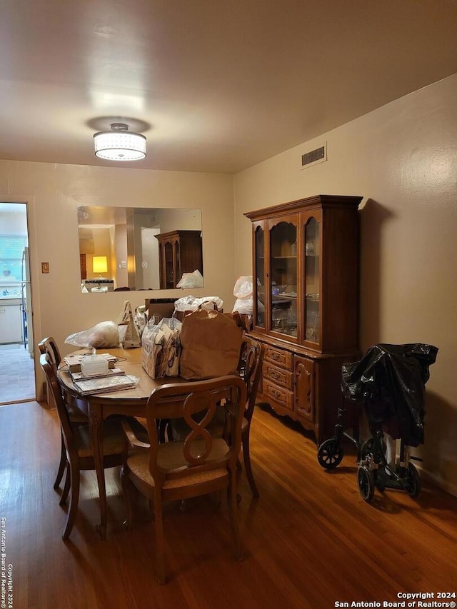 dining space featuring hardwood / wood-style floors