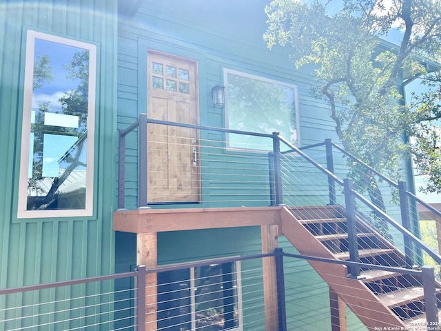 view of side of property with a balcony