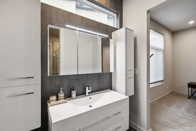 bathroom with vanity and wood-type flooring