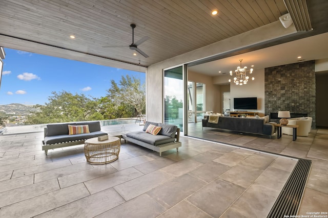 view of patio / terrace with a mountain view, an outdoor hangout area, and ceiling fan