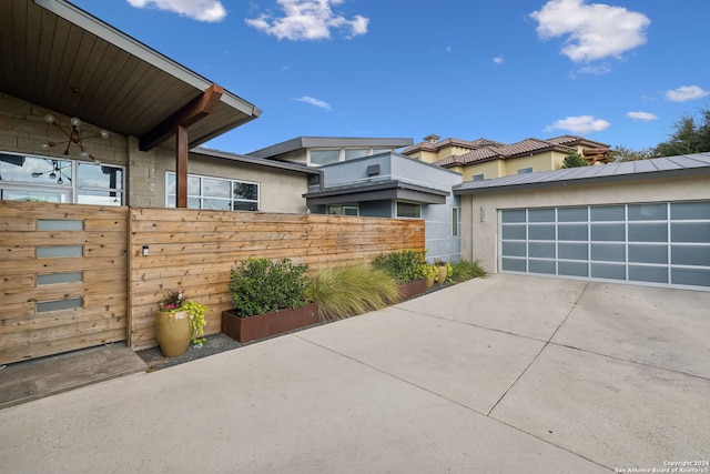 view of side of property with a garage