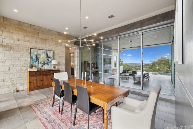 dining room featuring floor to ceiling windows