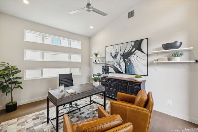 office area with hardwood / wood-style floors, high vaulted ceiling, and ceiling fan