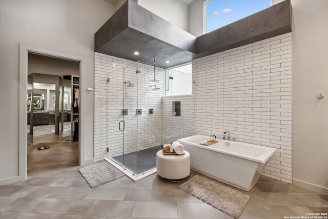 bathroom with separate shower and tub