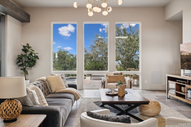 living room with a notable chandelier