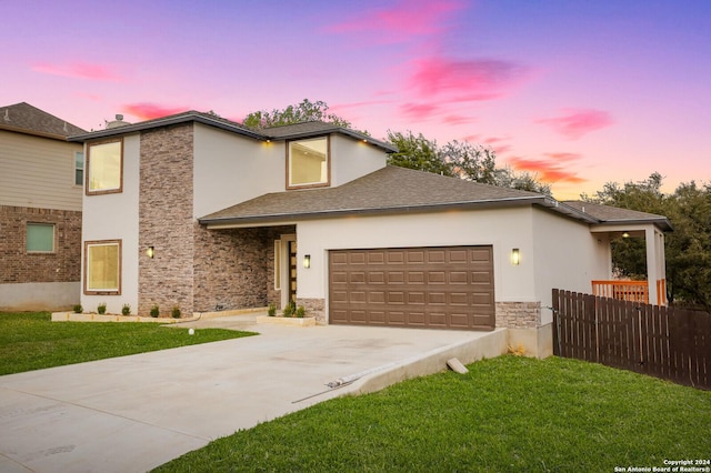 19402 Easy Oak, San Antonio, TX 78258 - view of front of home featuring a front yard, fence, concrete driveway, an attached garage, and stone siding