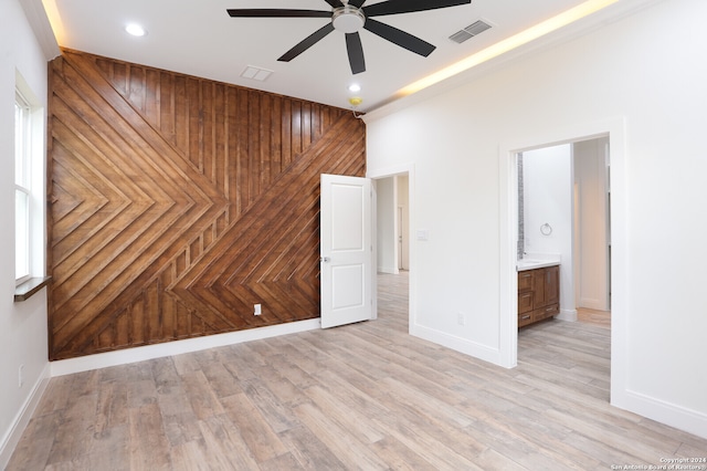 spare room with light hardwood / wood-style floors and ceiling fan