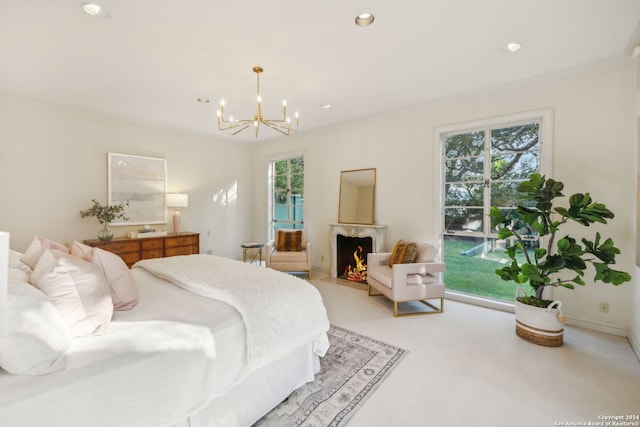 carpeted bedroom with a notable chandelier