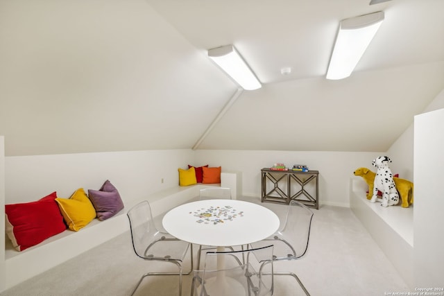 game room featuring light carpet and vaulted ceiling