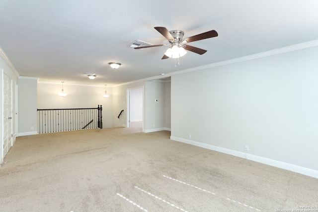 unfurnished room featuring light carpet and crown molding