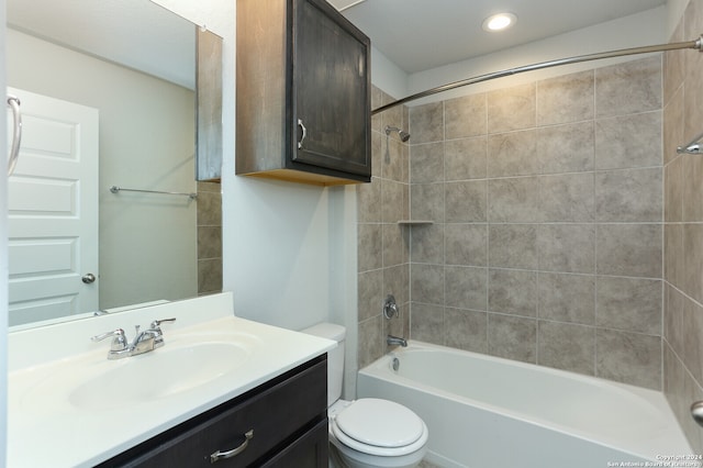 full bathroom featuring vanity, toilet, and tiled shower / bath