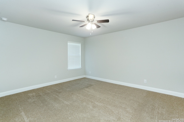 spare room with ceiling fan and carpet floors