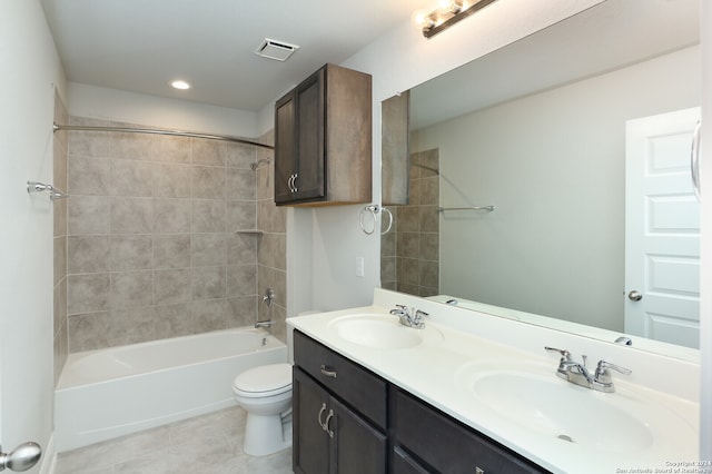 full bathroom with tile patterned flooring, vanity, toilet, and tiled shower / bath