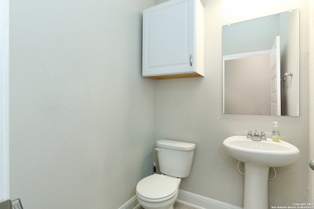 bathroom with sink and toilet