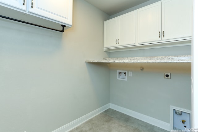 laundry room featuring hookup for an electric dryer, gas dryer hookup, washer hookup, and cabinets