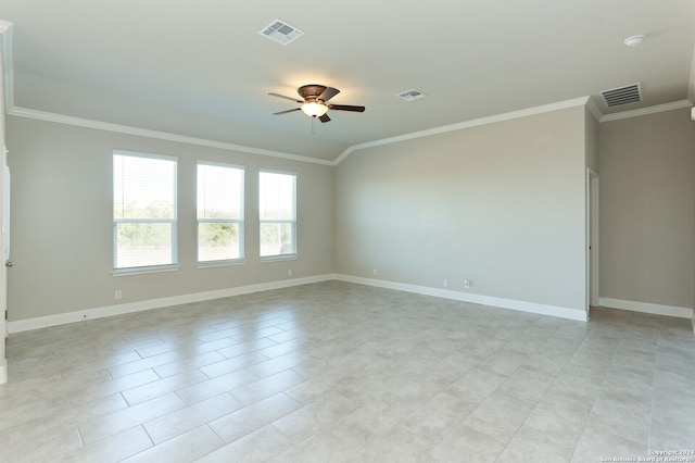 spare room featuring ornamental molding, ceiling fan, and light tile patterned floors