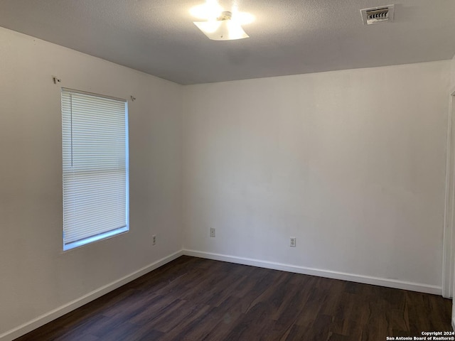 9058 Boston Hbr, San Antonio, TX 78242 - empty room with dark wood finished floors and baseboards