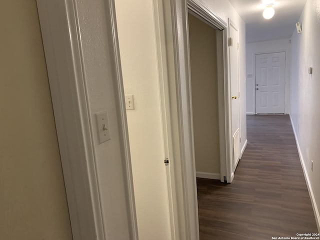 9058 Boston Hbr, San Antonio, TX 78242 - hallway with baseboards and dark wood-type flooring
