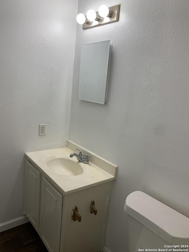 9058 Boston Hbr, San Antonio, TX 78242 - half bathroom with vanity and toilet