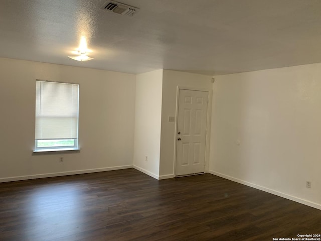 9058 Boston Hbr, San Antonio, TX 78242 - spare room with dark wood finished floors and baseboards