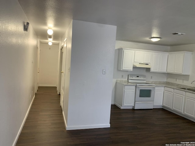 9058 Boston Hbr, San Antonio, TX 78242 - kitchen featuring white electric range, under cabinet range hood, baseboards, and dark wood-style flooring