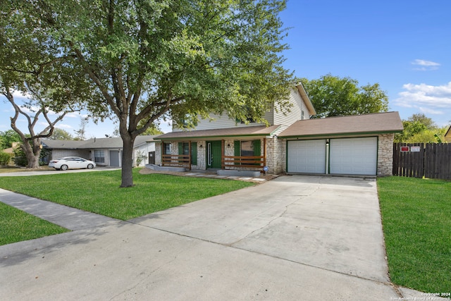 view of front facade with a front lawn and a garage