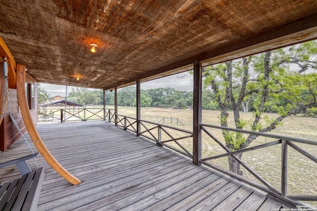 wooden terrace featuring a rural view