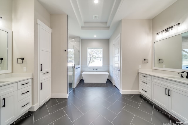 bathroom featuring vanity, shower with separate bathtub, and tile patterned floors