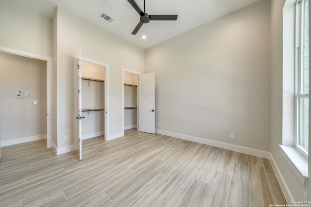 unfurnished bedroom with light wood-type flooring and ceiling fan