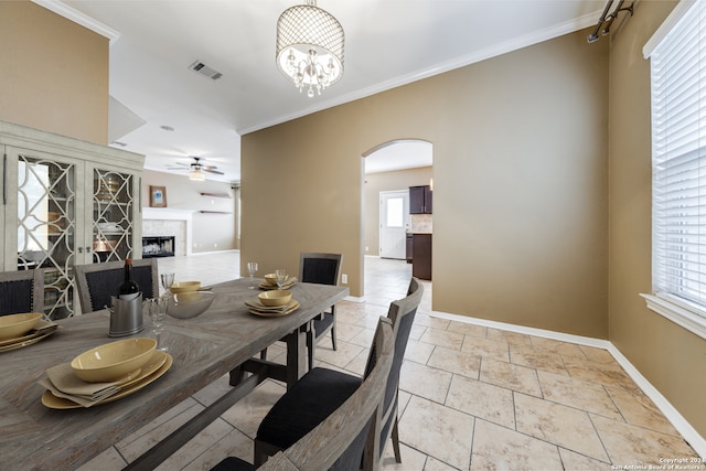 dining space featuring crown molding and ceiling fan