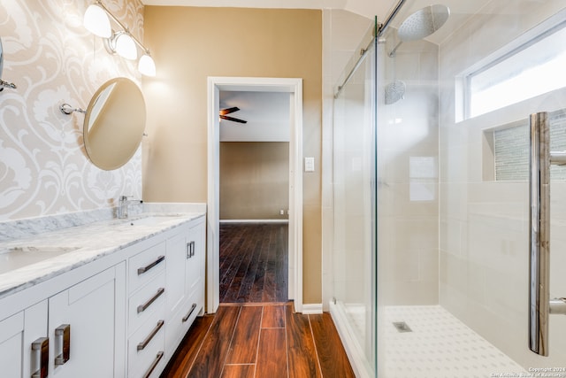 bathroom featuring vanity, ceiling fan, hardwood / wood-style flooring, and an enclosed shower